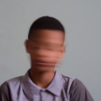 a boy with a blurred face